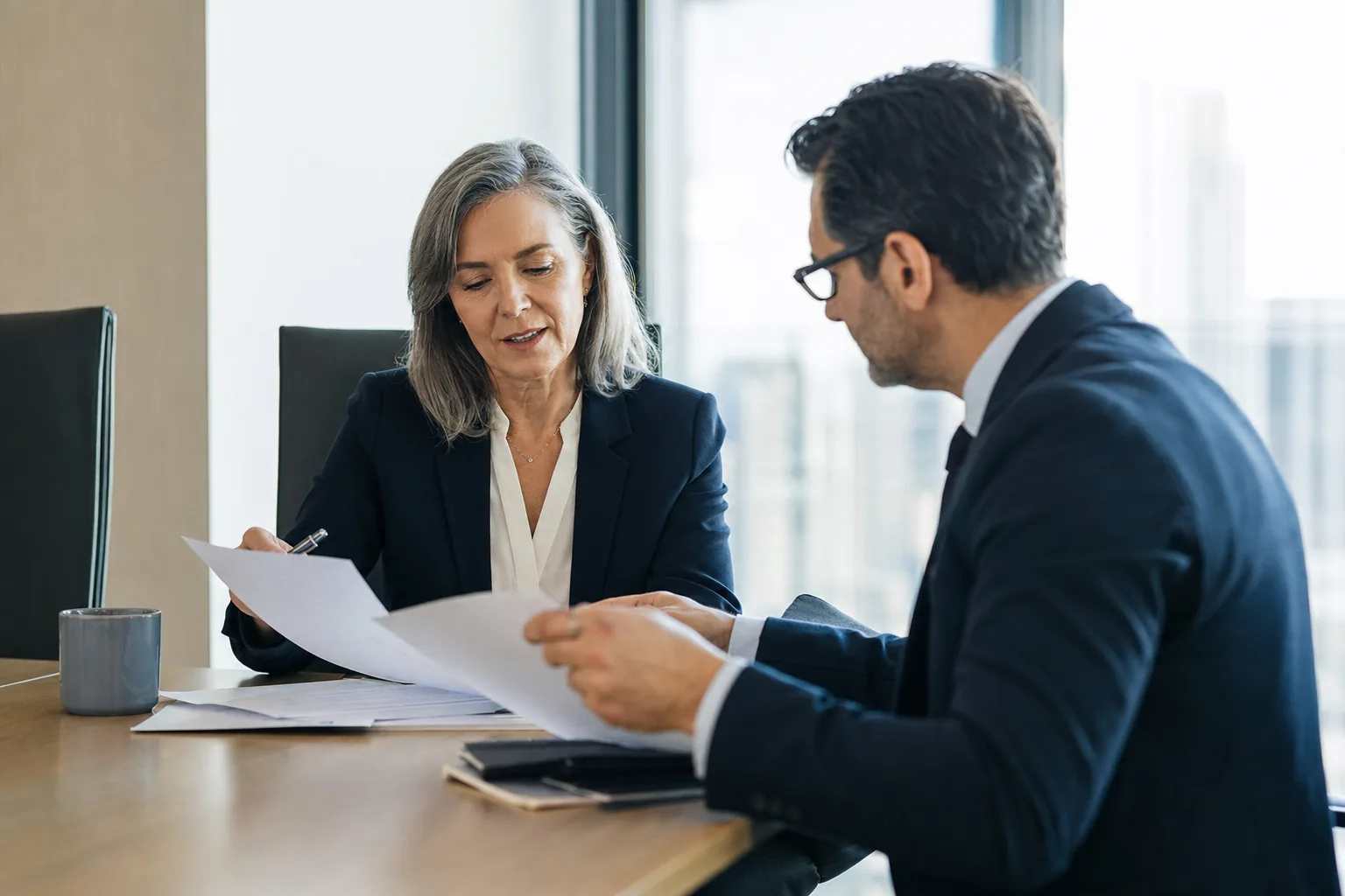 AI consultant reviewing implementation documents with a business owner before a project starts