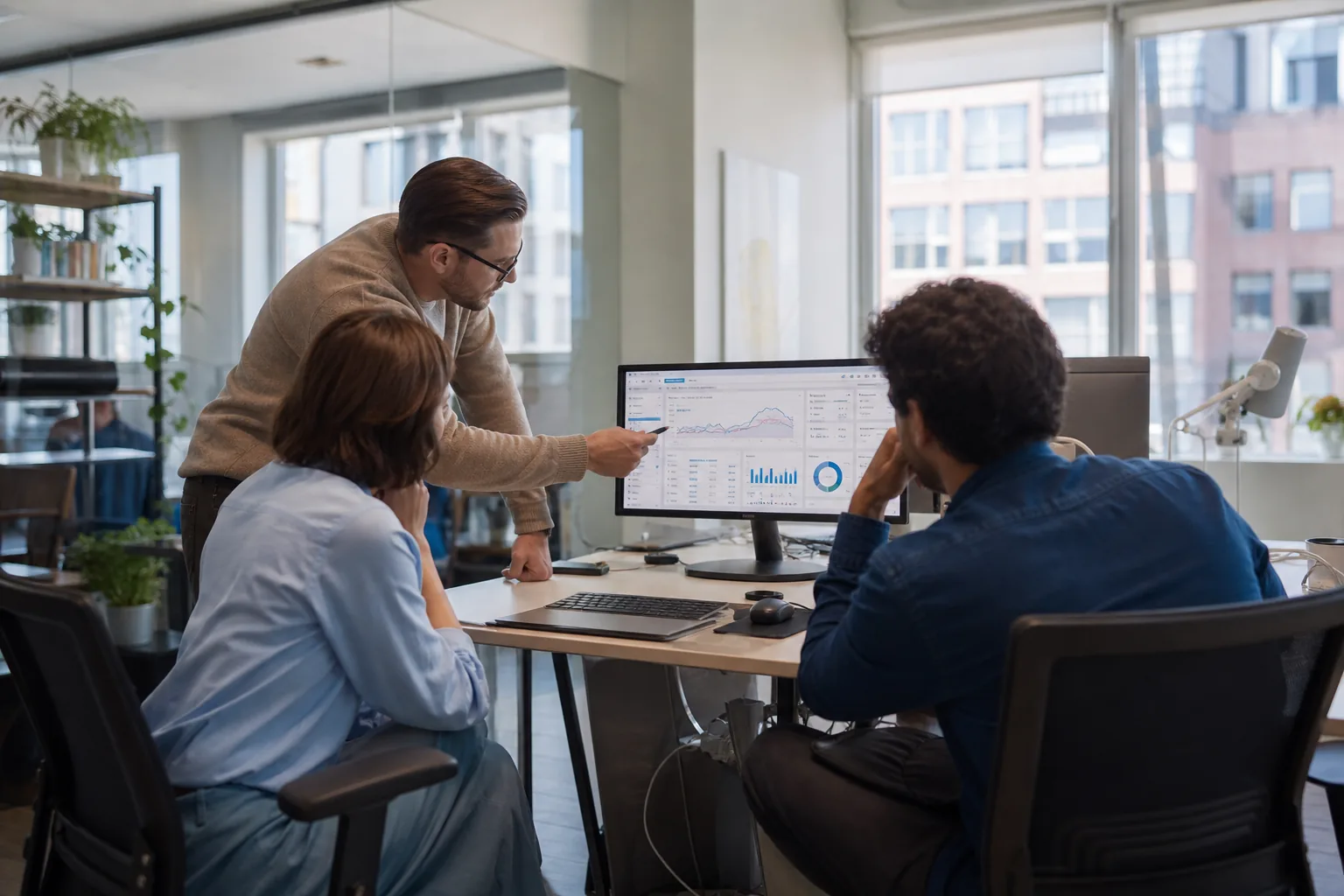 Small business team reviewing CRM data together as part of an agentic AI workflow